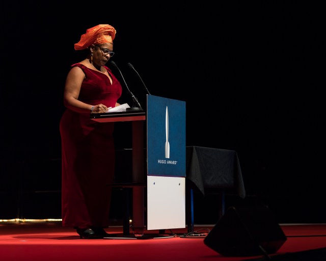 Nalo Hopkinson at the Hugo Award Ceremony 2017, Worldcon in Helsinki. Credits: Henry Söderlund CC BY 4.0. Photo link: https://commons.wikimedia.org/wiki/Category:Nalo_Hopkinson#/media/File:Nalo_Hopkinson,_at_the_Hugo_Award_Ceremony_2017,_Worldcon_in_Helsinki.jpg. CC link: https://creativecommons.org/licenses/by/4.0/