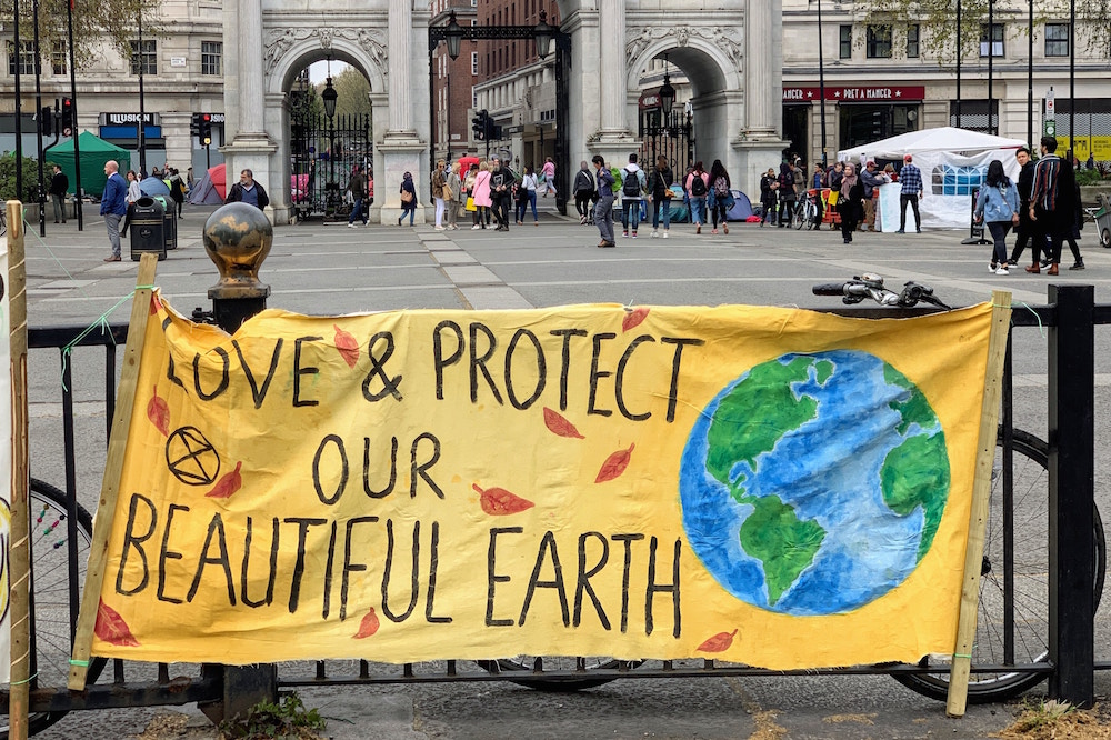 Banner reading "Save & Protect Our Beautiful Earth"