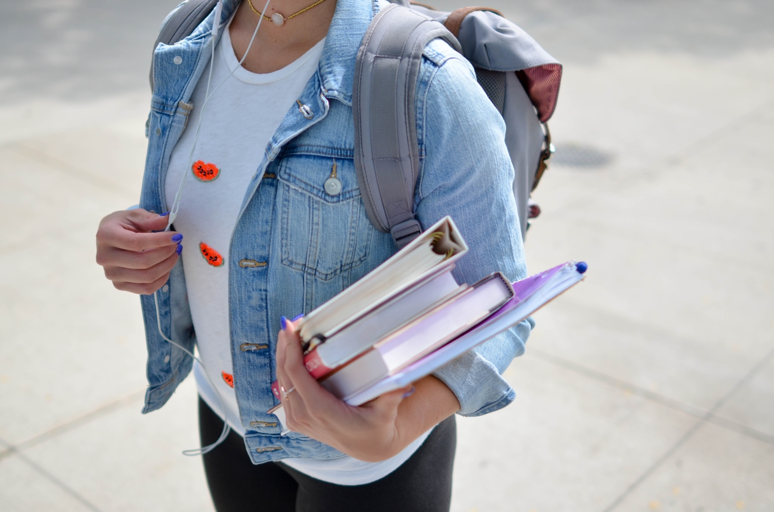 Teenage girl holding books