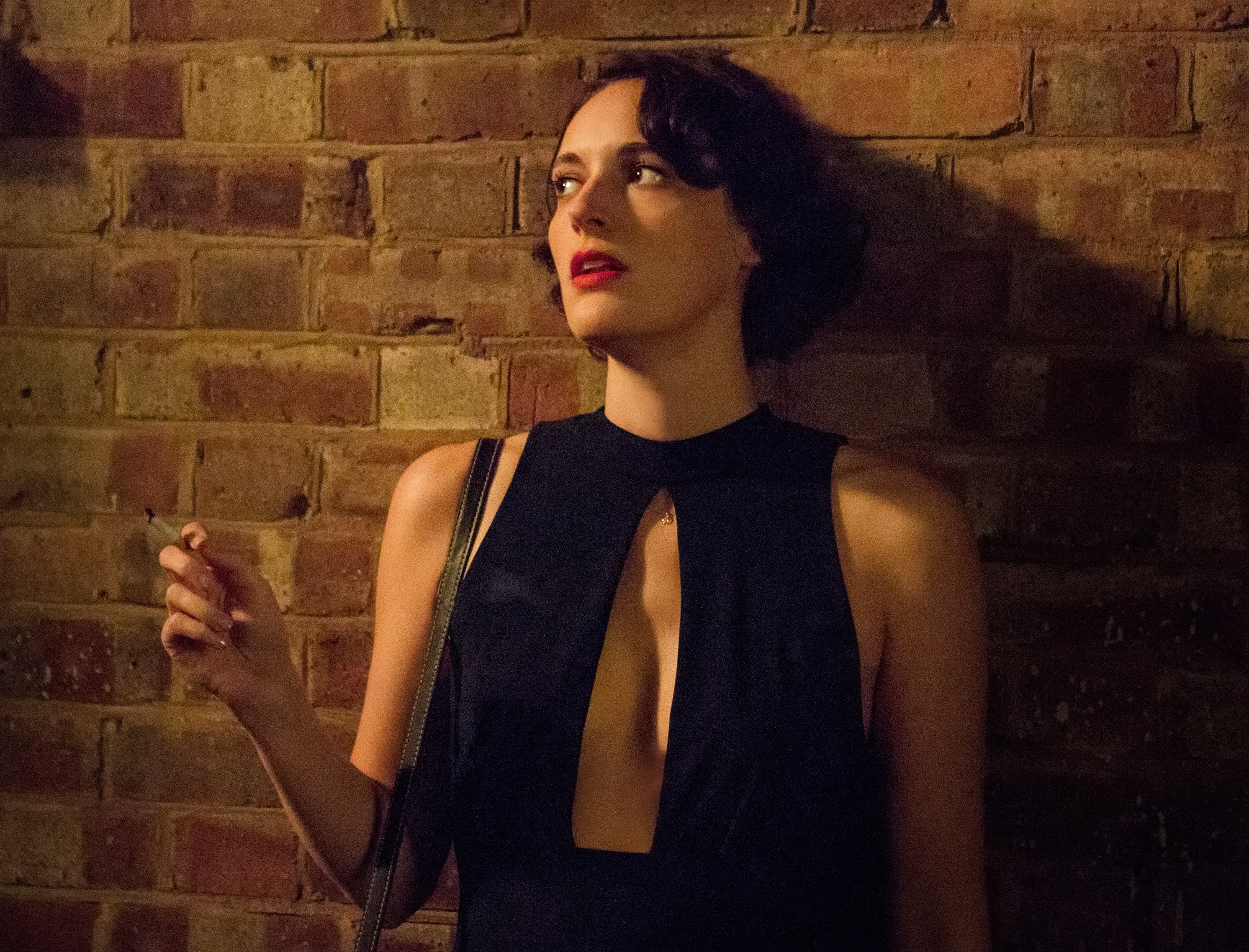 Screenshot from Fleabag, jumpsuit and smoking cigarette