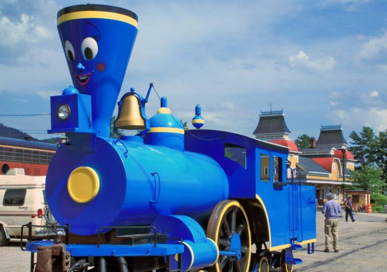 A real locomotive painted blue with a face like the Little Engine That Could from the book