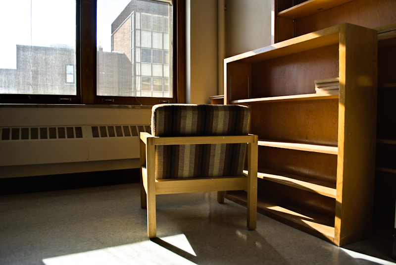 Chair and empty bookshelf