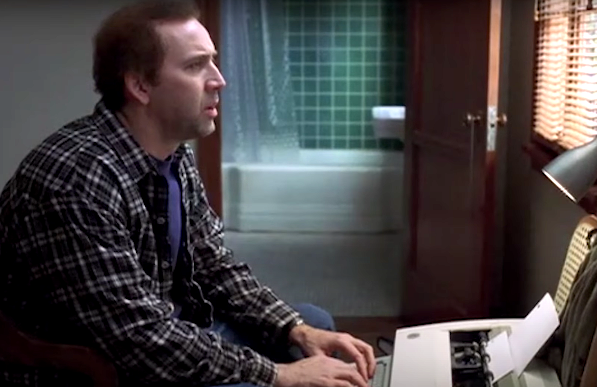 Nicolas Cage in Adaptation typing on a typewriter