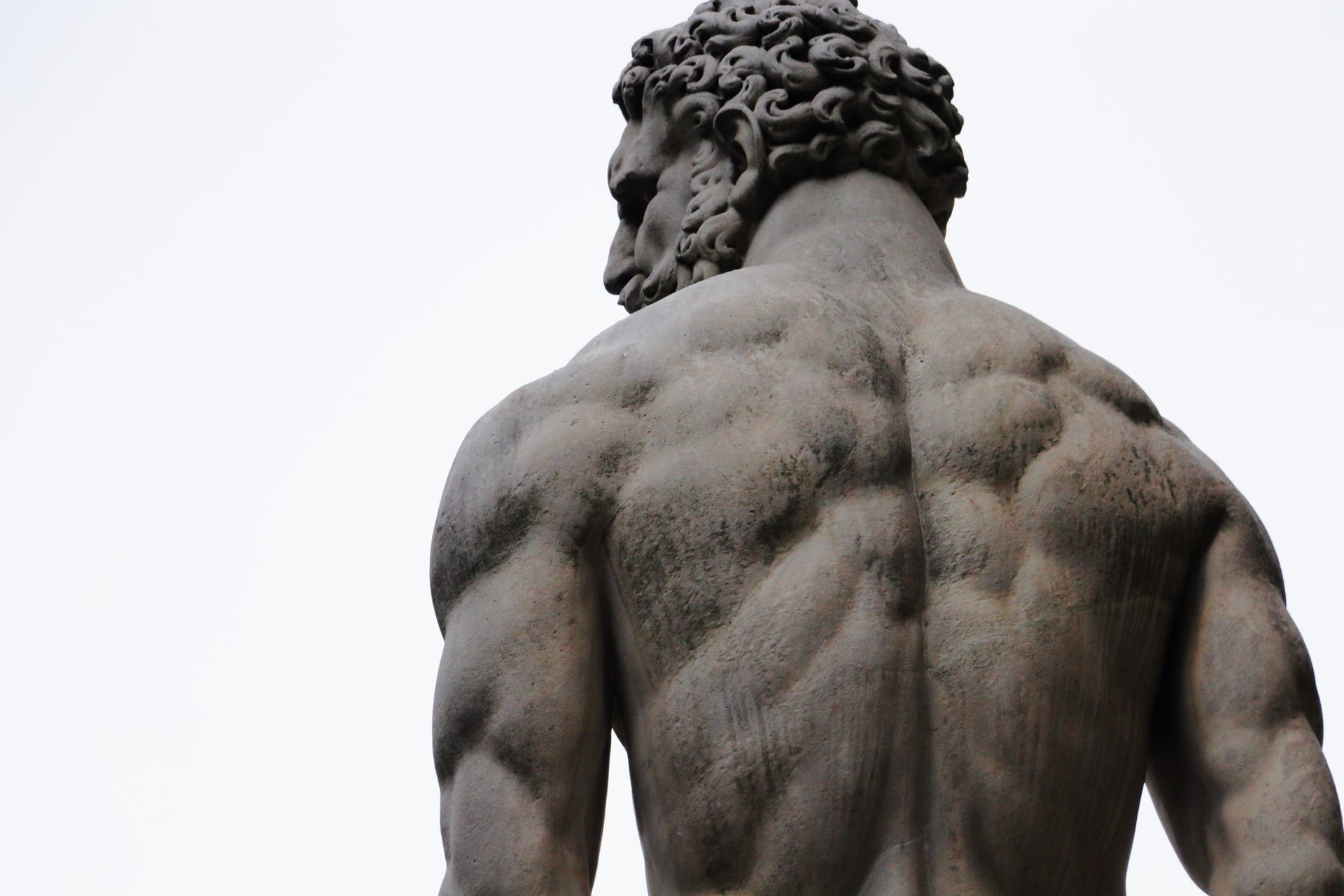 Statue of muscular man seen from behind