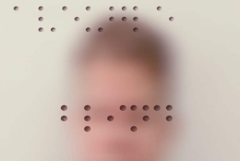 Blurry passport photo of a man with braille lettering overlaid
