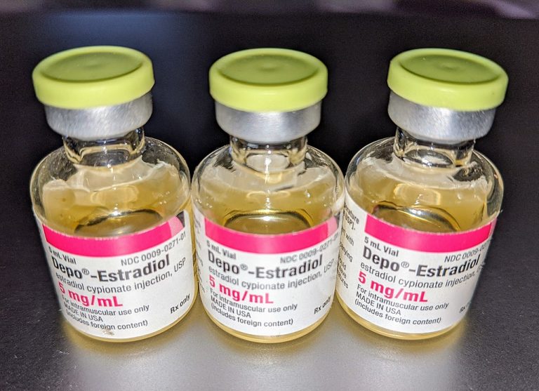 Three vials of light yellow liquid with a pink and white label reading "Depo-Estradiol, 5mg/mL"