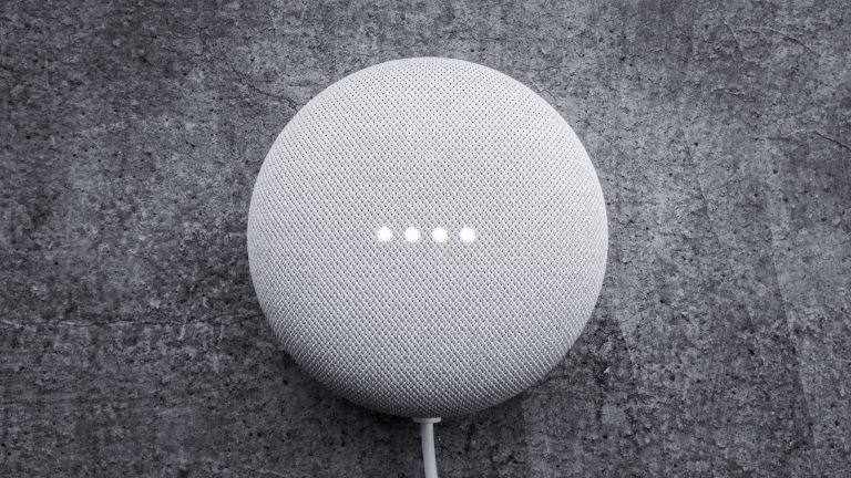 A white speaker glows as if listening