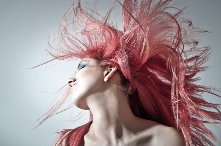 Woman with pink hair dancing