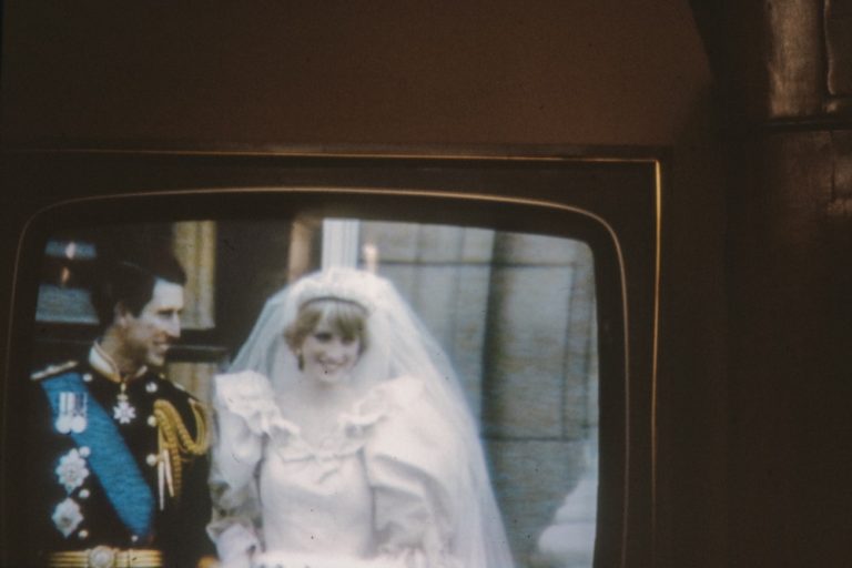 Princess Diana and Prince Charles broadcasted on a television set
