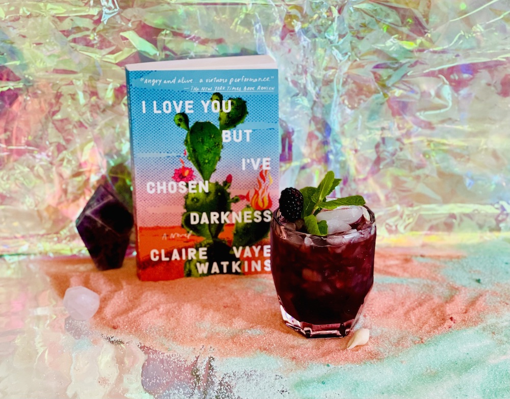 I Love You but I've Chosen Darkness book with a cocktail
