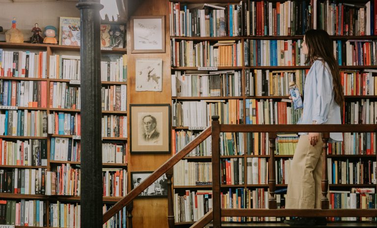 A woman browses the shelves at a book store