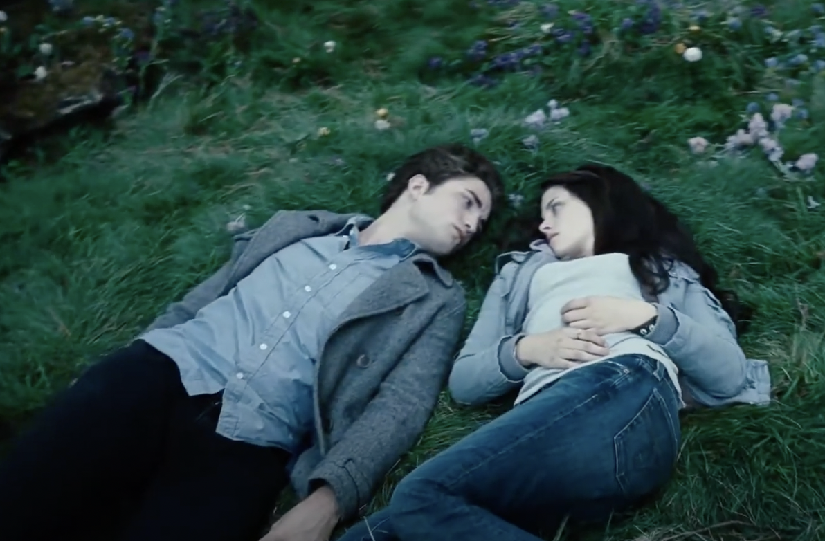 Twilight's Edward and Bella laying on the ground