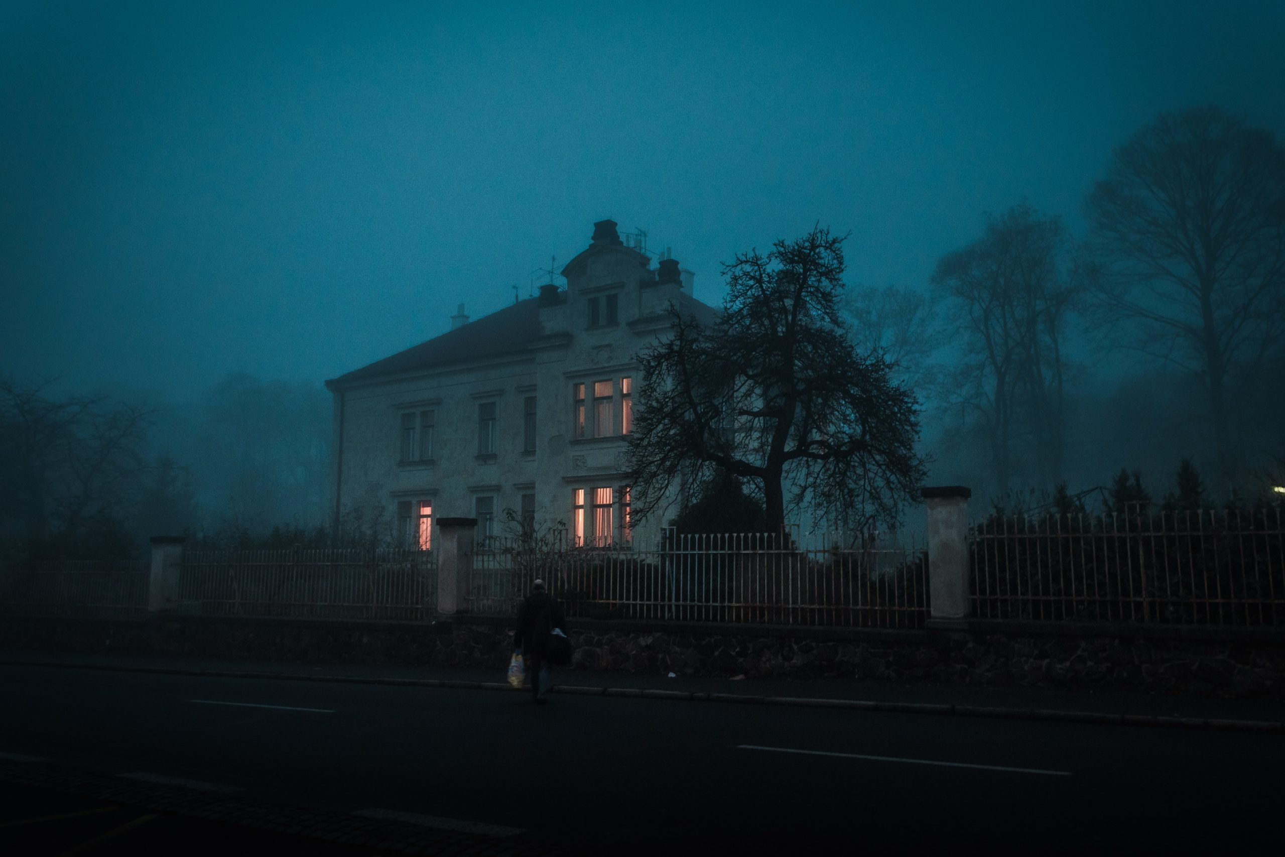 A haunted house surrounded by fog
